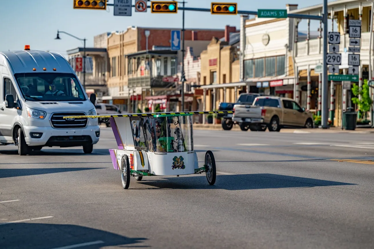 Car moving through a downtown road