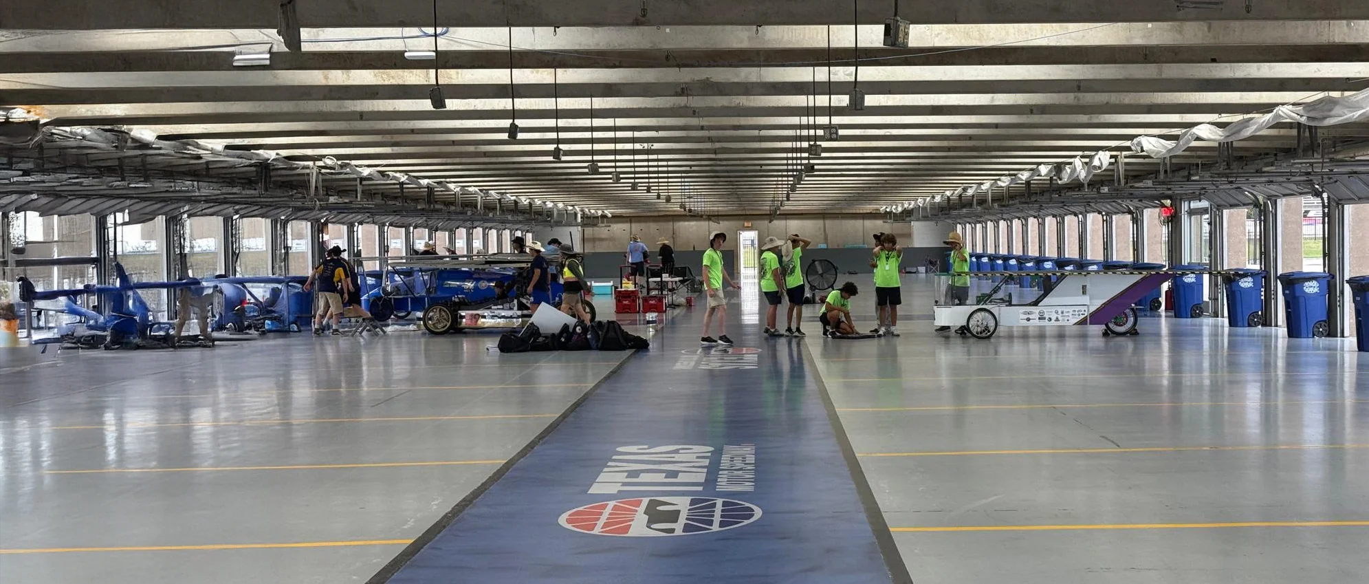 Solar racing teams and cars preparing in the Texas Motor Speedway garage