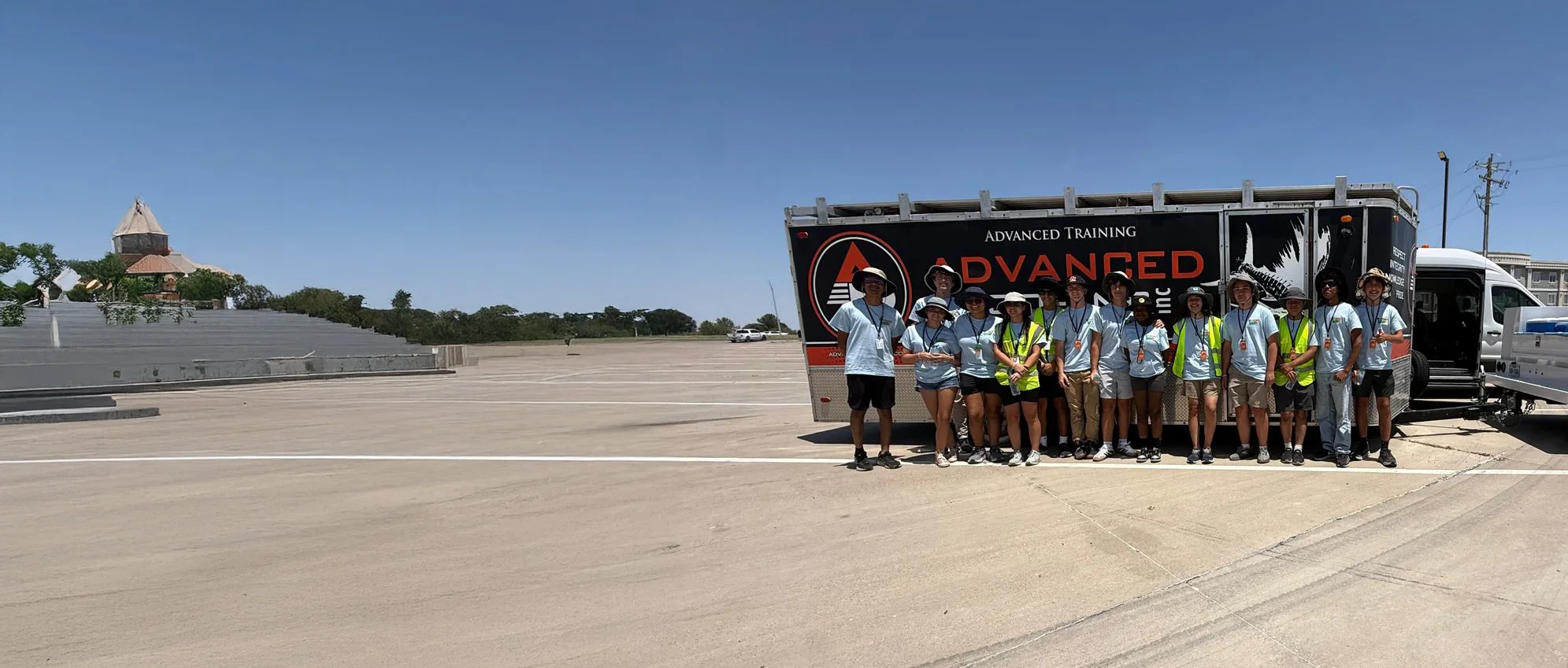 ALSET Paladins team members posing together beside the team trailer