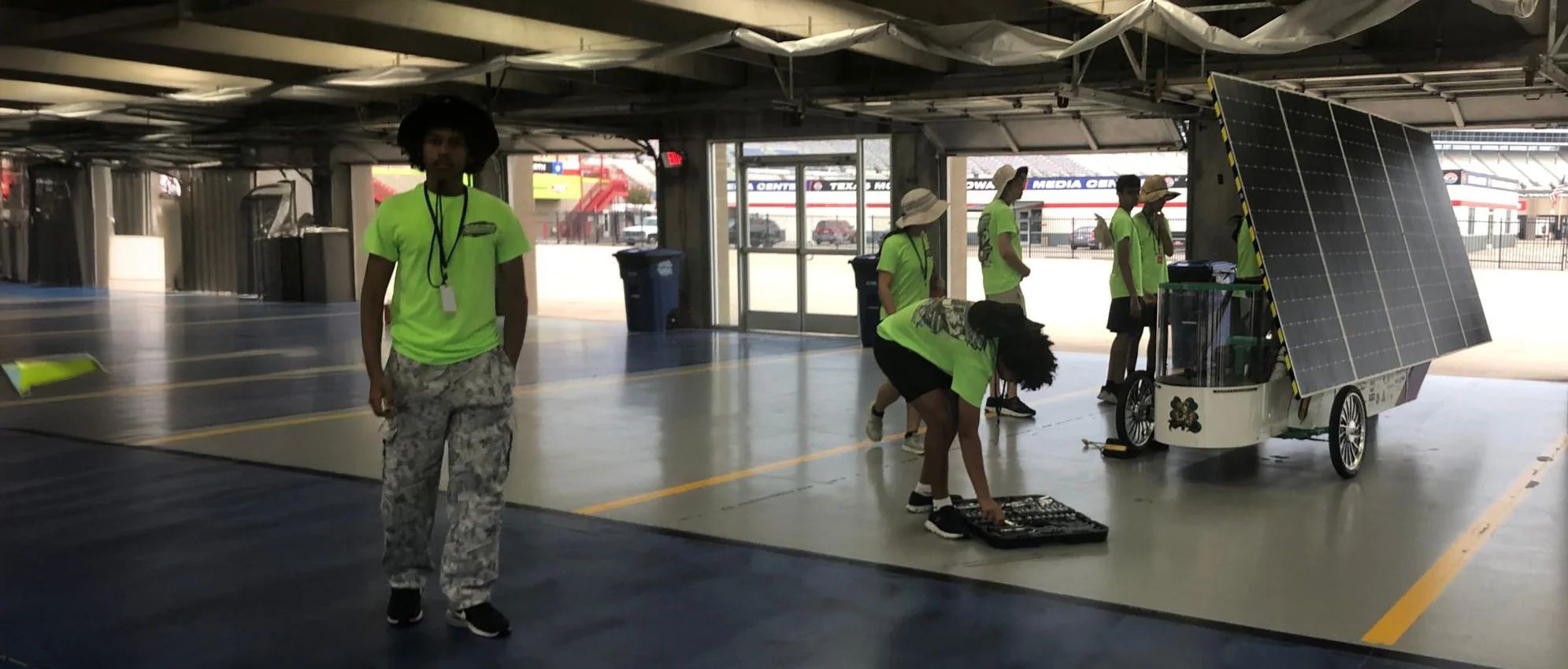ALSET Paladins students preparing their solar car in the garage